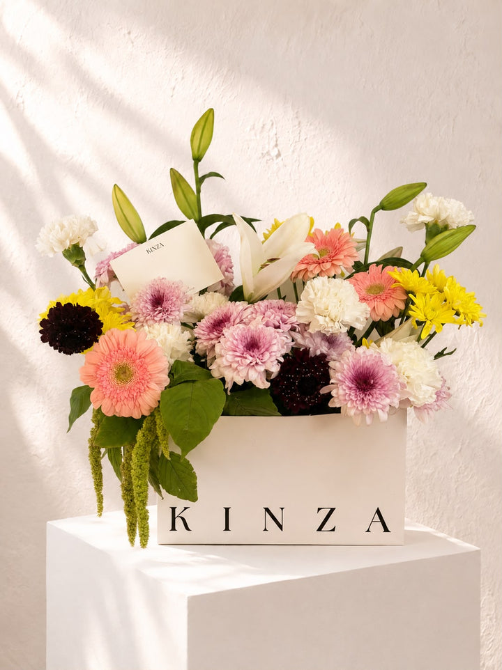 Signature Kinza White Bag Floral Arrangement - The Kinza Garden Mix
