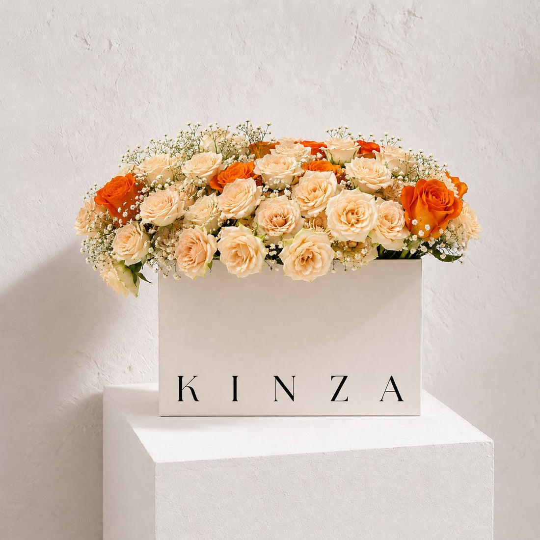 Signature Kinza White Bag Floral Arrangement - Sunset Rose