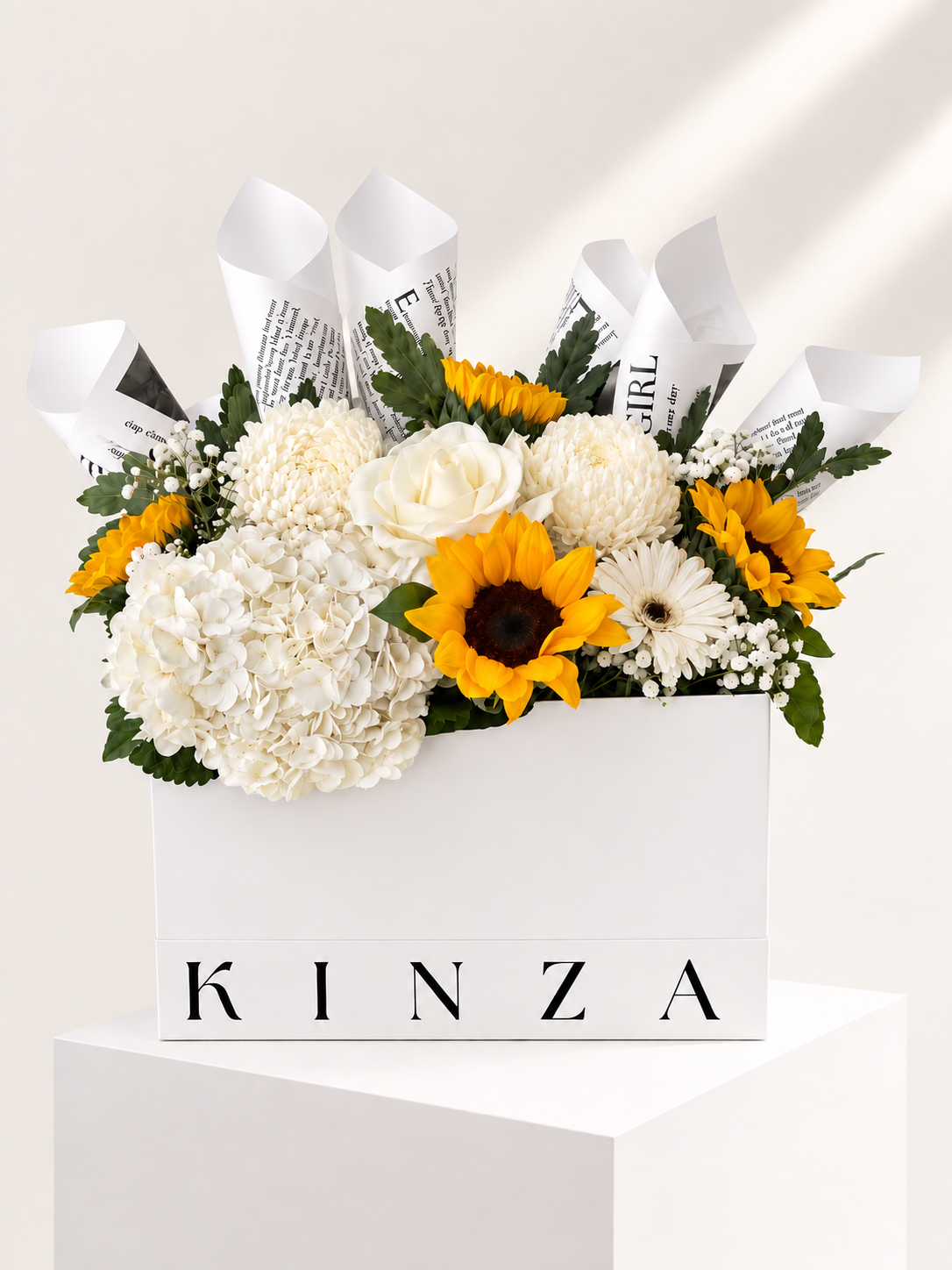 Signature Kinza White Bag Floral Arrangement - Golden Petal Symphony