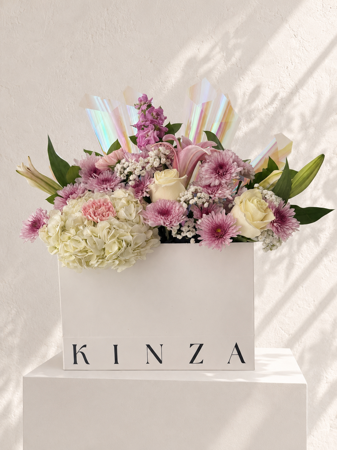 Signature Kinza White Bag Floral Arrangement - Lilac Garden